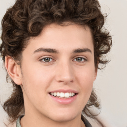 Joyful white young-adult male with medium  brown hair and brown eyes