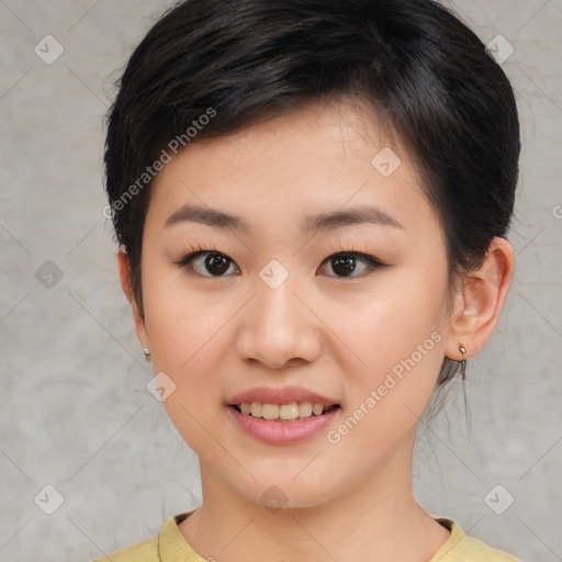 Joyful asian young-adult female with short  brown hair and brown eyes