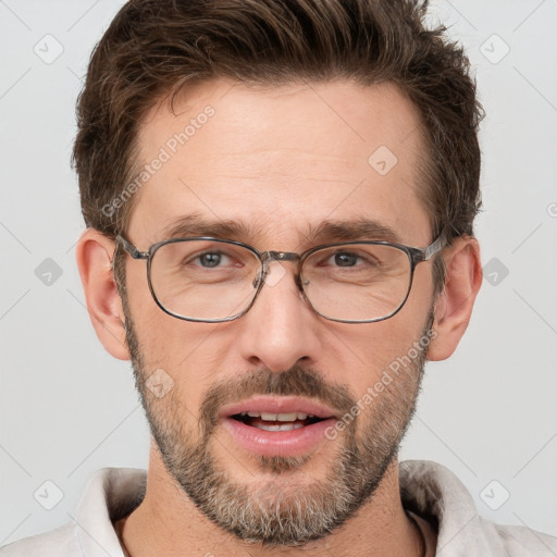 Joyful white adult male with short  brown hair and brown eyes