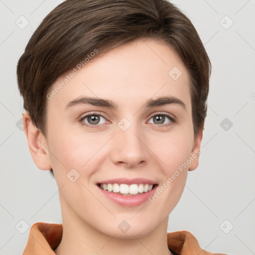 Joyful white young-adult female with short  brown hair and grey eyes