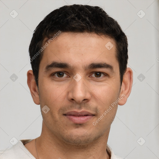 Joyful white young-adult male with short  black hair and brown eyes