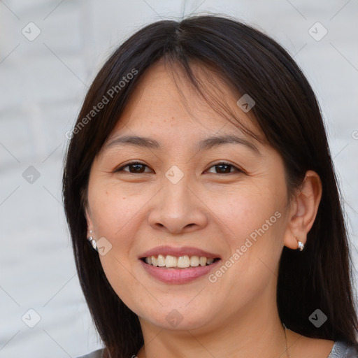 Joyful white young-adult female with medium  brown hair and brown eyes