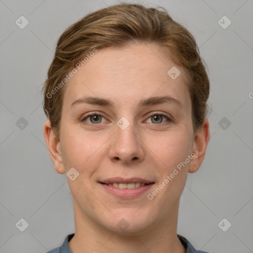 Joyful white young-adult female with short  brown hair and grey eyes