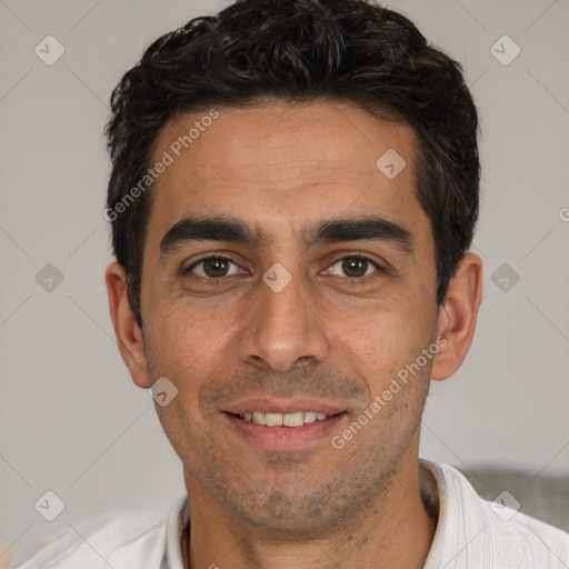 Joyful white young-adult male with short  black hair and brown eyes