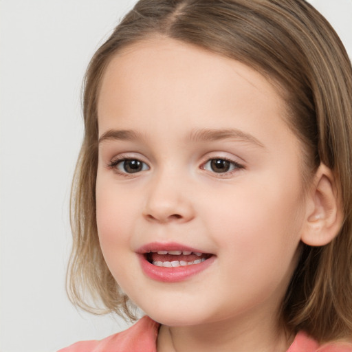 Joyful white child female with long  brown hair and brown eyes