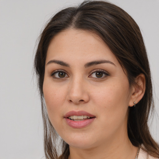 Joyful white young-adult female with medium  brown hair and brown eyes