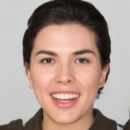 Joyful white young-adult female with medium  brown hair and brown eyes