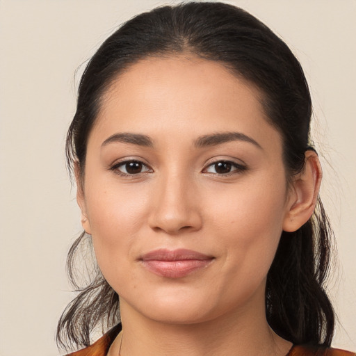 Joyful white young-adult female with long  brown hair and brown eyes