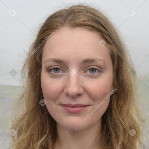 Joyful white young-adult female with long  brown hair and blue eyes