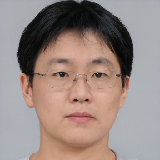 Neutral asian young-adult male with short  brown hair and brown eyes