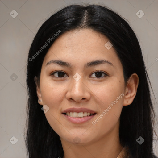 Joyful latino young-adult female with long  brown hair and brown eyes