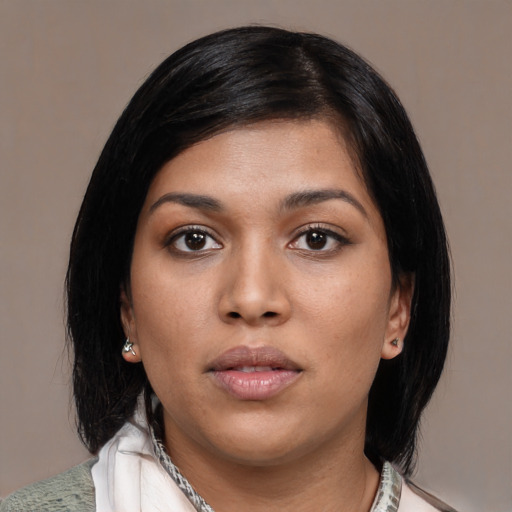 Neutral black young-adult female with medium  black hair and brown eyes