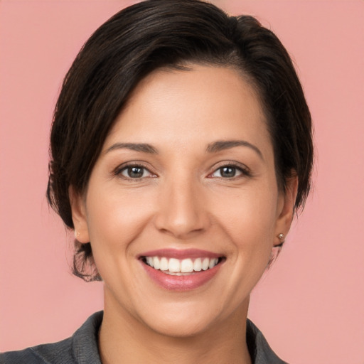 Joyful white young-adult female with medium  brown hair and brown eyes