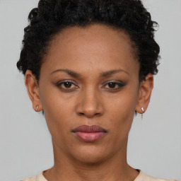 Neutral black young-adult female with short  black hair and brown eyes