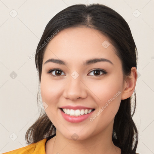 Joyful white young-adult female with medium  brown hair and brown eyes