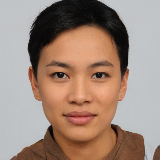 Joyful asian young-adult female with short  black hair and brown eyes