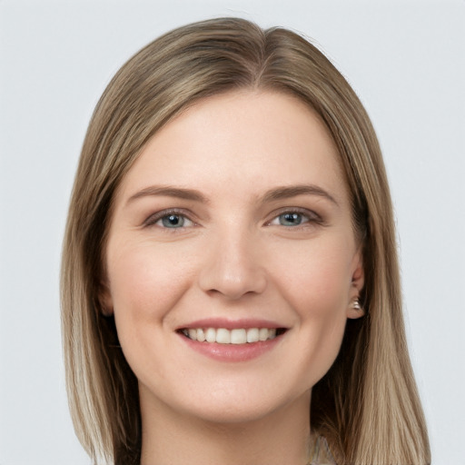 Joyful white young-adult female with long  brown hair and grey eyes