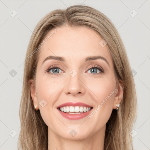 Joyful white young-adult female with long  brown hair and green eyes