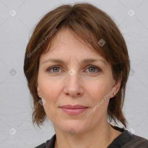 Joyful white adult female with medium  brown hair and grey eyes