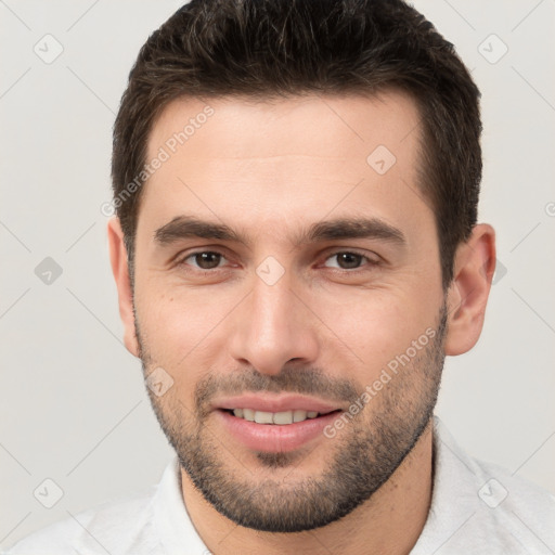 Joyful white young-adult male with short  brown hair and brown eyes