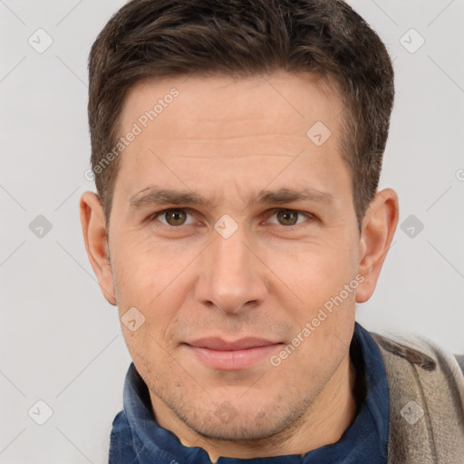 Joyful white adult male with short  brown hair and brown eyes