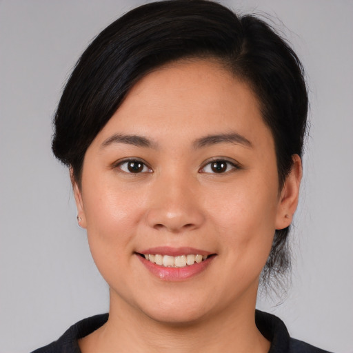 Joyful white young-adult female with medium  brown hair and brown eyes