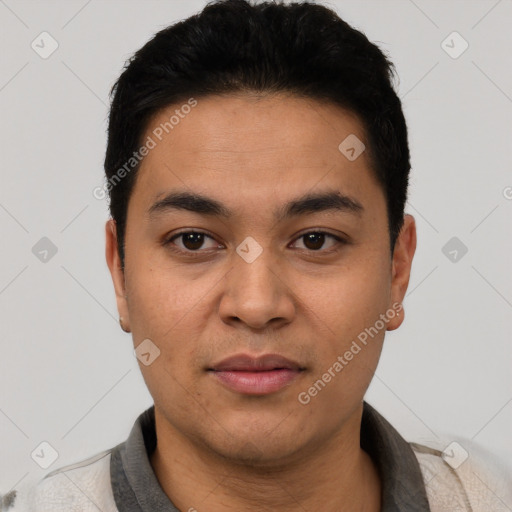 Joyful white young-adult male with short  black hair and brown eyes