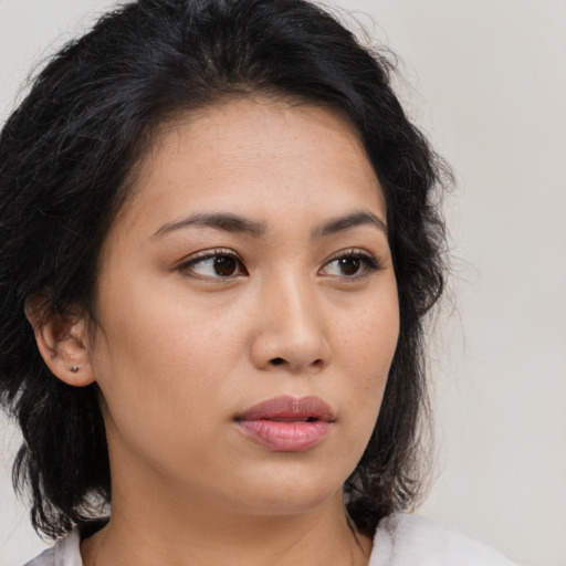 Neutral latino young-adult female with medium  brown hair and brown eyes