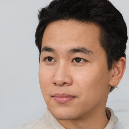 Neutral asian young-adult male with short  black hair and brown eyes