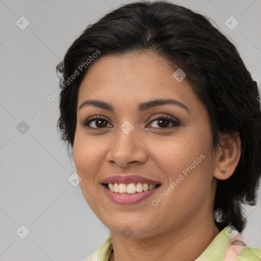 Joyful latino young-adult female with long  brown hair and brown eyes