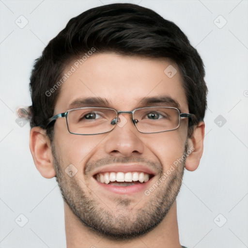 Joyful white young-adult male with short  black hair and brown eyes