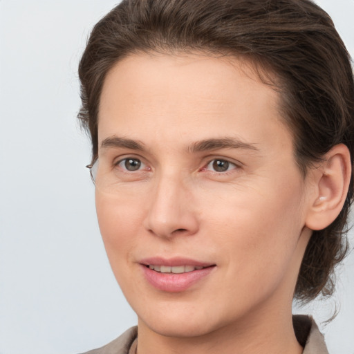 Joyful white young-adult female with medium  brown hair and brown eyes