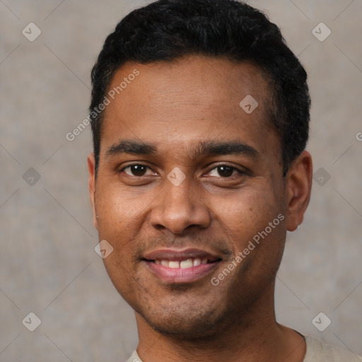 Joyful latino young-adult male with short  black hair and brown eyes