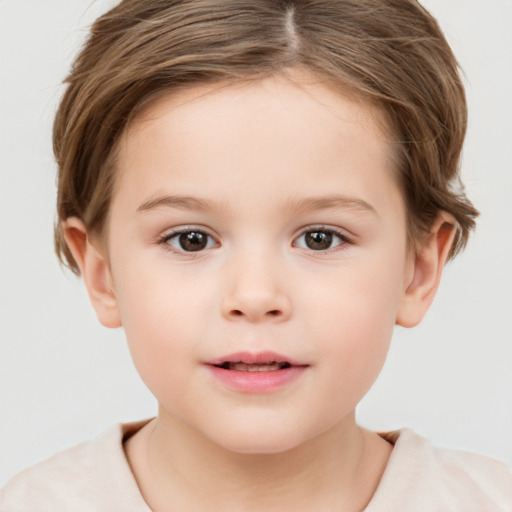 Joyful white child female with short  brown hair and brown eyes