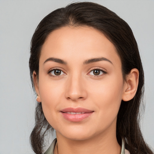 Joyful white young-adult female with medium  brown hair and brown eyes