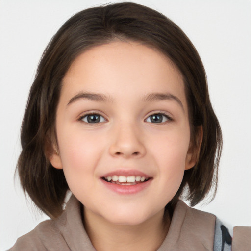 Joyful white child female with medium  brown hair and brown eyes