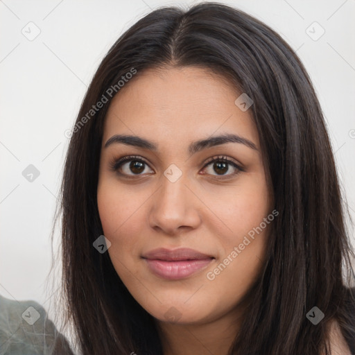 Joyful latino young-adult female with long  brown hair and brown eyes