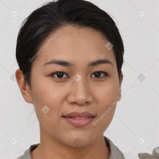 Joyful asian young-adult female with short  brown hair and brown eyes