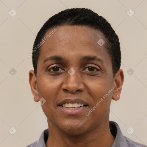Joyful black young-adult male with short  black hair and brown eyes