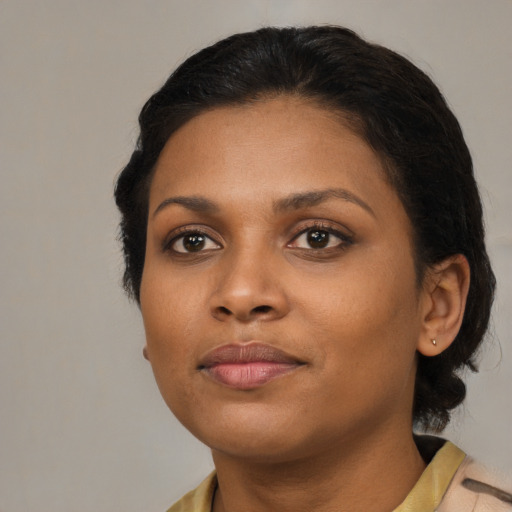 Neutral black young-adult female with medium  black hair and brown eyes