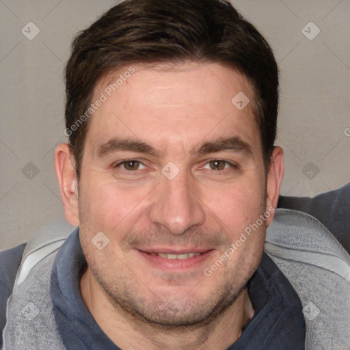 Joyful white adult male with short  brown hair and brown eyes