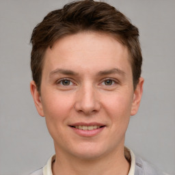 Joyful white young-adult female with short  brown hair and grey eyes