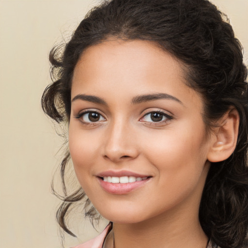 Joyful white young-adult female with long  brown hair and brown eyes