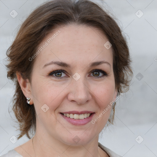 Joyful white adult female with medium  brown hair and grey eyes