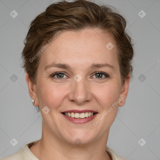 Joyful white adult female with short  brown hair and grey eyes