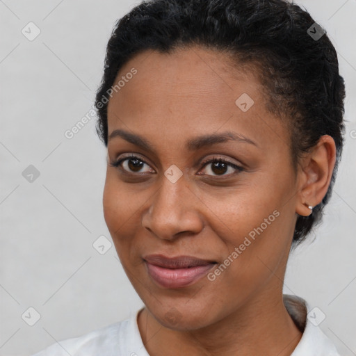 Joyful latino young-adult female with short  brown hair and brown eyes