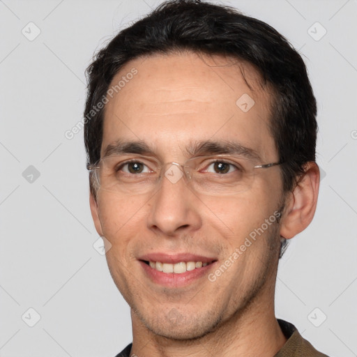 Joyful white adult male with short  brown hair and brown eyes