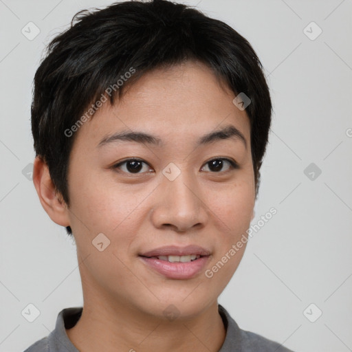 Joyful asian young-adult female with short  brown hair and brown eyes