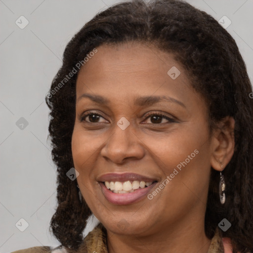 Joyful black young-adult female with medium  brown hair and brown eyes