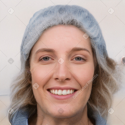 Joyful white young-adult female with medium  brown hair and blue eyes